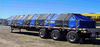 Picture of vinyl lumber tarp for for flatbed trucks with 8-foot side drops, from American Tarping.