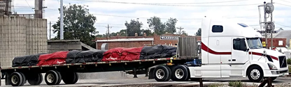 Picture of vinyl lumber tarp for for flatbed trucks with 8-foot side drops, from American Tarping.